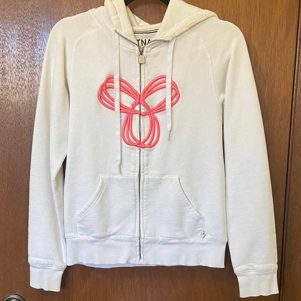 TNA White Zip Hoodie with Hot Pink Logo